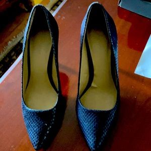 Navy blue heels about 3.5 inches.